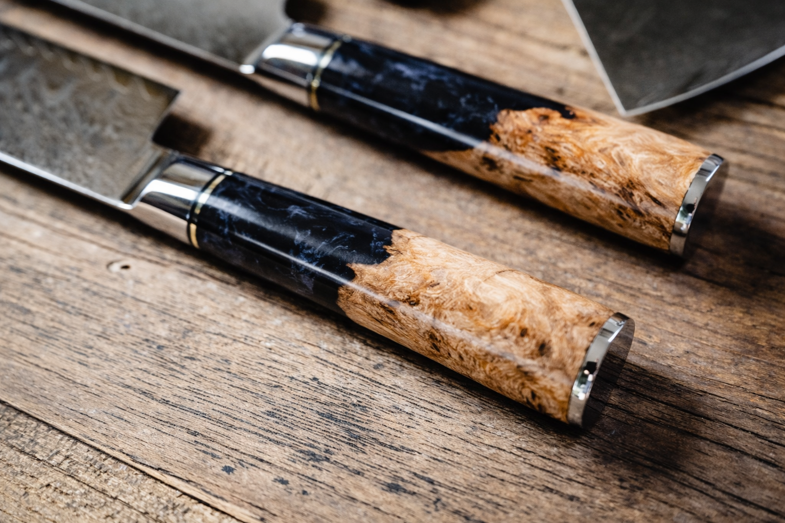 Black burl handle close-up on personalized engraved Damascus knife — Tidal Series