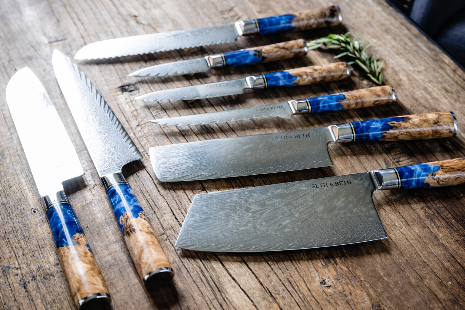 Blue burl handle close-up on personalized engraved Damascus knife — Tidal Series